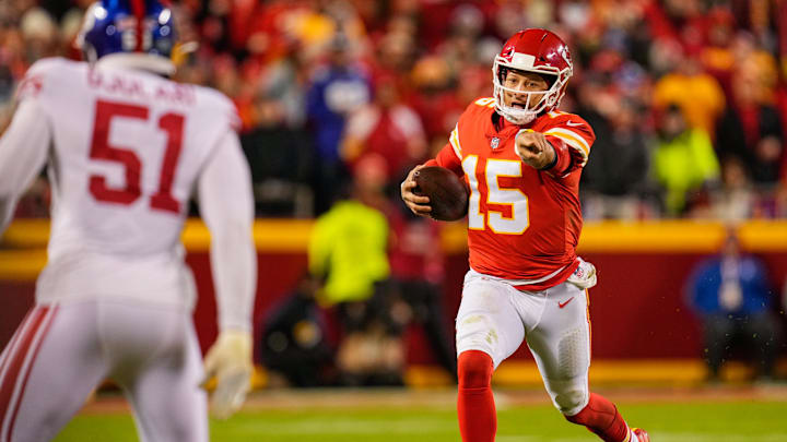 Nov 1, 2021; Kansas City, Missouri, USA; Kansas City Chiefs quarterback Patrick Mahomes (15) gestures as he runs with the ball as New York Giants outside linebacker Azeez Ojulari (51) defends during the second half at GEHA Field at Arrowhead Stadium. Mandatory Credit: Jay Biggerstaff-Imagn Images