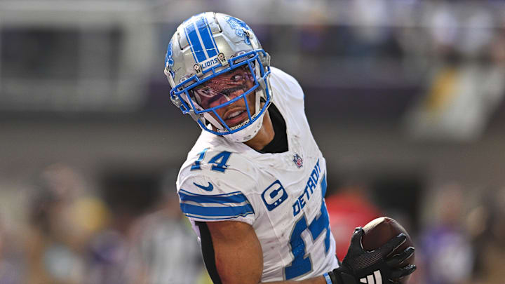 Oct 20, 2024; Minneapolis, Minnesota, USA; Detroit Lions wide receiver Amon-Ra St. Brown (14) reacts after catching a 35 yard touchdown pass from quarterback Jared Goff (not pictured) against the Minnesota Vikings the second quarter at U.S. Bank Stadium. Mandatory Credit: Jeffrey Becker-Imagn Images