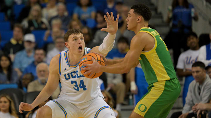 Dec 6, 2025; Los Angeles, California, USA;  UCLA Bruins forward Tyler Bilodeau (34) guards Oregon Ducks guard Jackson Shelstad (3) during the first half at Pauley Pavilion presented by Wescom Financial. Mandatory Credit: Jayne Kamin-Oncea-Imagn Images