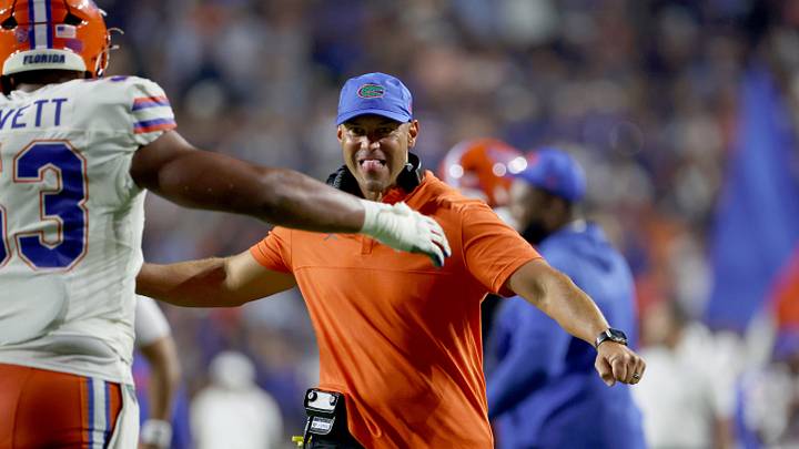 Sep 19, 2026; Auburn, Alabama, USA; Florida Gators head coach Jon Sumrall celebrates with offensive lineman Bryce Lovett (53) after the Gators scored a touchdown during the fourth quarter against the Auburn Tigers at Jordan-Hare Stadium. Mandatory Credit: John Reed-Imagn Images Sep 19, 2026; Auburn, Alabama, USA; Florida Gators head coach Jon Sumrall celebrates with offensive lineman Bryce Lovett (53) after the Gators scored a touchdown during the fourth quarter against the Auburn Tigers at Jordan-Hare Stadium. Mandatory Credit: John Reed-Imagn Images