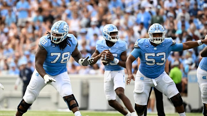 Sep 7, 2024; Chapel Hill, North Carolina, USA; North Carolina Tar Heels quarterback Conner Harrell (15) looks to pass as offensive linemen Trevyon Green (78) and Willie Lampkin (53) block in the second quarter at Kenan Memorial Stadium. Mandatory Credit: Bob Donnan-Imagn Images