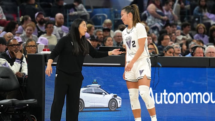 Golden State Valkyries head coach Natalie Nakase (left) talks with guard Kaitlyn Chen (2) during the second quarter against the Connecticut Sun at Chase Center. 