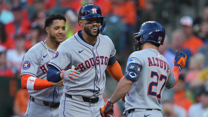 Aug 23, 2025; Baltimore, Maryland, USA; Houston Astros third baseman Carlos Correa (1) greeted by designated hitter Jose Altuve (27) following his two-run home run in the first inning  against the Baltimore Orioles at Oriole Park at Camden Yards. Mandatory Credit: Mitch Stringer-Imagn Images