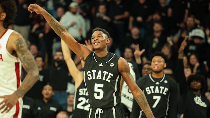 Jan 29, 2025; Starkville, Mississippi, USA; Mississippi State Bulldogs guard Shawn Jones Jr. (5) reacts after a three point basket against the Alabama Crimson Tide during the second half at Humphrey Coliseum. Mandatory Credit: Wesley Hale-Imagn Images