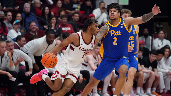 Feb 25, 2026; Stanford, California, USA;  Stanford Cardinal guard Ebuka Okorie (1) dribbles against Pittsburgh Panthers forward Cameron Corhen (2) in the second half at Maples Pavilion. Mandatory Credit: David Gonzales-Imagn Images