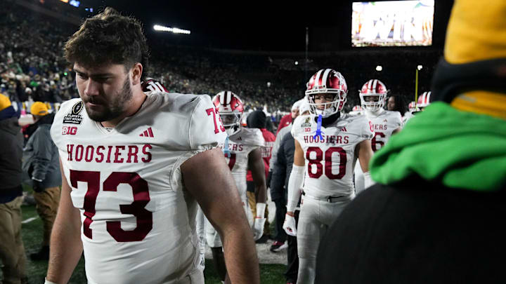 Indiana Hoosiers offensive lineman Austin Barrett (73) leaves the field along with other players after losing a game between the Indiana Hoosiers and the Notre Dame Fighting Irish in first round of the College Football Playoff on Saturday, Dec. 21, 2024, in South Bend. Notre Dame defeated Indiana 27-17.