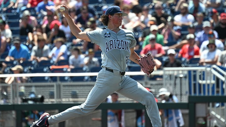 Jun 15, 2025; Omaha, Neb, USA; Arizona Wildcats starting pitcher Smith Bailey (22) throws against the Louisville Cardinals during the sixth inning at Charles Schwab Field. Mandatory Credit: Steven Branscombe-Imagn Images