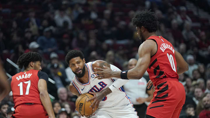 Dec 30, 2024; Portland, Oregon, USA; Philadelphia 76ers forward Paul George (8) looks to pass the ball against Portland Trail Blazers guard Scoot Henderson (00) during the first half at Moda Center. Mandatory Credit: Soobum Im-Imagn Images Dec 30, 2024; Portland, Oregon, USA; Philadelphia 76ers forward Paul George (8) looks to pass the ball against Portland Trail Blazers guard Scoot Henderson (00) during the first half at Moda Center. Mandatory Credit: Soobum Im-Imagn Images