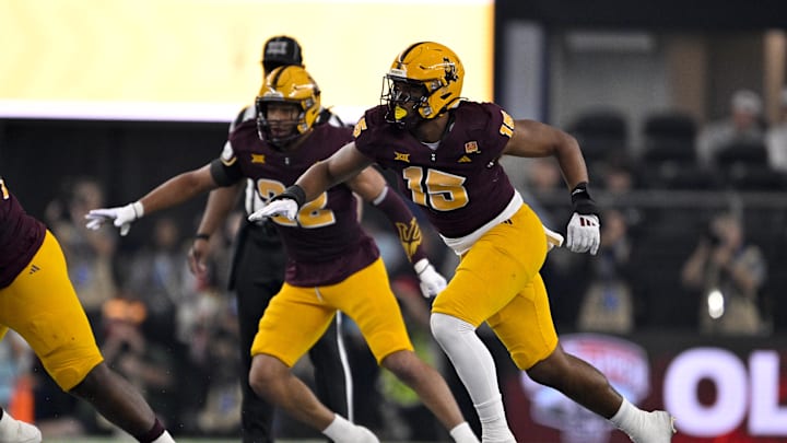 Dec 7, 2024; Arlington, TX, USA; Arizona State Sun Devils linebacker Caleb McCullough (22) and defensive lineman Elijah O'Neal (15) in action during the game between the Iowa State Cyclones and the Arizona State Sun Devils at AT&T Stadium. Mandatory Credit: Jerome Miron-Imagn Images Dec 7, 2024; Arlington, TX, USA; Arizona State Sun Devils linebacker Caleb McCullough (22) and defensive lineman Elijah O'Neal (15) in action during the game between the Iowa State Cyclones and the Arizona State Sun Devils at AT&T Stadium. Mandatory Credit: Jerome Miron-Imagn Images