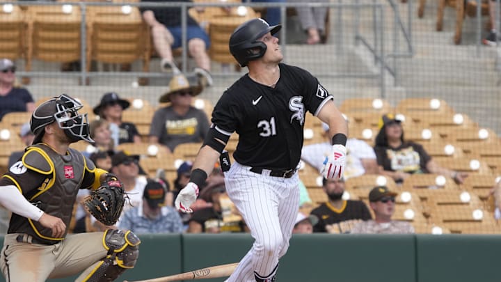 Chicago White Sox right fielder Zach DeLoach (31) hits a single against the San Diego Padres in the third inning at Camelback Ranch-Glendale in 2024.