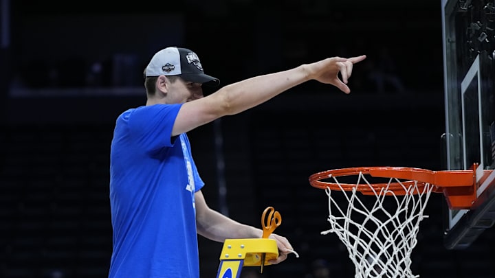 Mar 29, 2025; San Francisco, CA, USA; Florida Gators forward Alex Condon (21) cuts down the net after defeating the Texas Tech Red Raiders during the West Regional final of the 2025 NCAA tournament at Chase Center. Mandatory Credit: Kyle Terada-Imagn Images
