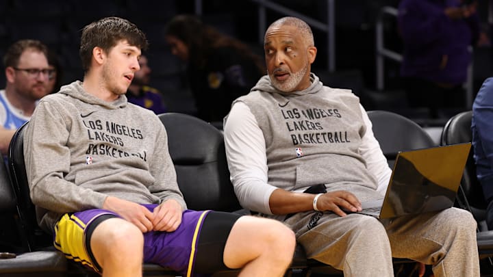 Mar 22, 2024; Los Angeles, California, USA;  Los Angeles Lakers guard Austin Reaves (L) talks with assistant coach Phil Handy (R) prior to the game against the Philadelphia 76ers at Crypto.com Arena. Mandatory Credit: Kiyoshi Mio-Imagn Images