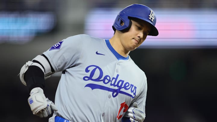 Sep 19, 2024; Miami, Florida, USA; Los Angeles Dodgers designated hitter Shohei Ohtani (17) circles the bases after hitting a two-run home run against the Miami Marlins during the seventh inning at loanDepot Park. Mandatory Credit: Sam Navarro-Imagn Images