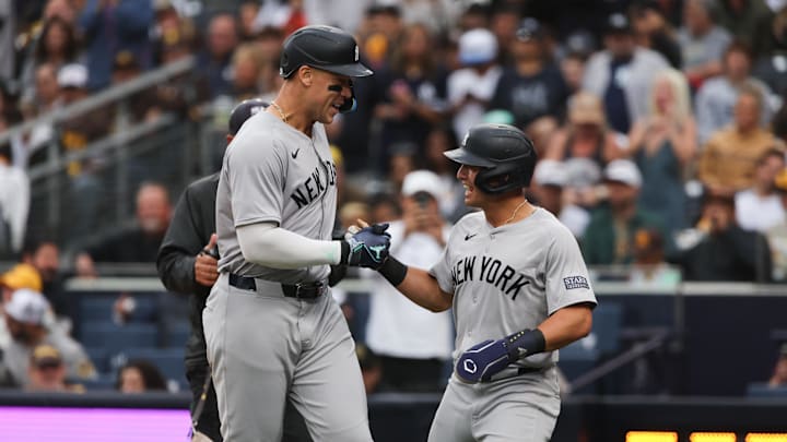 May 25, 2024; San Diego, California, USA; New York Yankees center fielder Aaron Judge (99) celebrates with shortstop Anthony Volpe (11) after hitting a two-run home run in the first inning against the San Diego Padres at Petco Park. Mandatory Credit: Chadd Cady-USA TODAY Sports