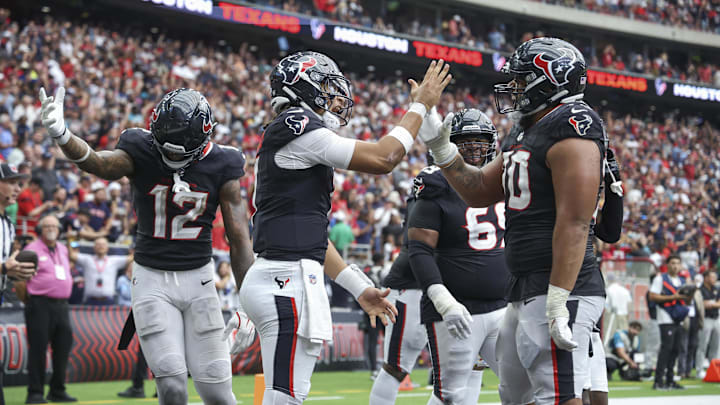 Sep 29, 2024; Houston, Texas, USA; Houston Texans quarterback C.J. Stroud (7) celebrates with center Juice Scruggs (70) after a Texans touchdown during the fourth quarter against the Jacksonville Jaguars at NRG Stadium. Mandatory Credit: Troy Taormina-Imagn Images Sep 29, 2024; Houston, Texas, USA; Houston Texans quarterback C.J. Stroud (7) celebrates with center Juice Scruggs (70) after a Texans touchdown during the fourth quarter against the Jacksonville Jaguars at NRG Stadium. Mandatory Credit: Troy Taormina-Imagn Images