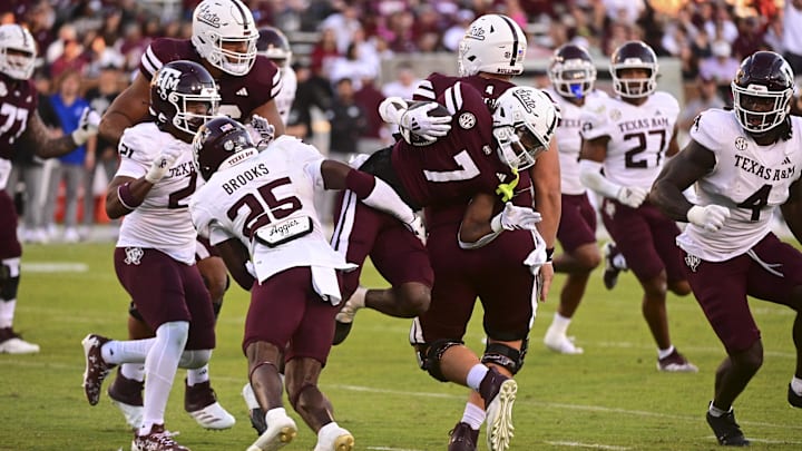 Oct 19, 2024; Starkville, Mississippi, USA; Mississippi State Bulldogs wide receiver Mario Craver (7) runs the ball against Texas A&M Aggies defensive back Dalton Brooks (25) on a play that would result in an apparent injury to Craver during the third quarter at Davis Wade Stadium at Scott Field. Mandatory Credit: Matt Bush-Imagn Images