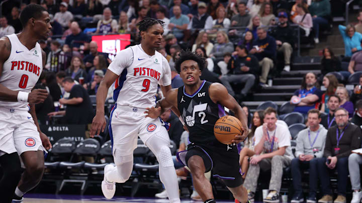 Mar 3, 2025; Salt Lake City, Utah, USA; Utah Jazz guard Collin Sexton (2) dribbles past Detroit Pistons forward Ausar Thompson (9) and center Jalen Duren (0) during the second half at Delta Center. Mandatory Credit: Rob Gray-Imagn Images