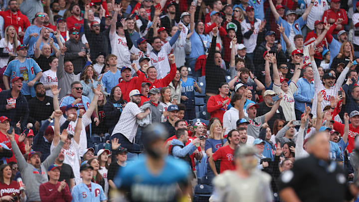 Apr 18, 2025; Philadelphia, Pennsylvania, USA; Fans react behind Philadelphia Phillies first base Bryce Harper (3) as he hits a two RBI home run against the Miami Marlins during the first inning at Citizens Bank Park. Mandatory Credit: Bill Streicher-Imagn Images