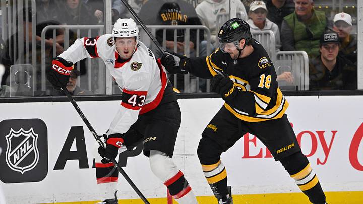 Oct 5, 2026; Boston, Massachusetts, USA; Ottawa Senators defenseman Tyler Kleven (43) shields the puck from Boston Bruins center Pavel Zacha (18) during the first period at TD Garden. Mandatory Credit: Eric Canha-Imagn Images