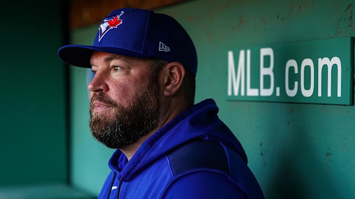 Apr 9, 2025; Boston, Massachusetts, USA; Toronto Blue Jays manager John Schneider (14) talks with reporters before the start of the game against the Boston Red Sox at Fenway Park. 
