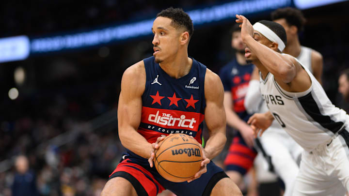 Feb 10, 2025; Washington, District of Columbia, USA; Washington Wizards guard Malcolm Brogdon (15) drives to the basket against San Antonio Spurs forward Keldon Johnson (0) during the second quarter at Capital One Arena. Mandatory Credit: Reggie Hildred-Imagn Images