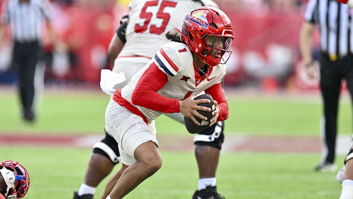 Oct 18, 2025; Houston, Texas, USA; Arizona Wildcats quarterback Noah Fifita (1) runs the ball during the second quarter against the Houston Cougars at TDECU Stadium. Mandatory Credit: Maria Lysaker-Imagn Images 