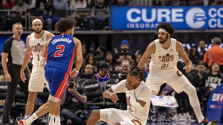 Feb 5, 2025; Detroit, Michigan, USA; Detroit Pistons guard Cade Cunningham (2) collides with Cleveland Cavaliers guard Darius Garland (10) during the second half at Little Caesars Arena. Mandatory Credit: David Reginek-Imagn Images