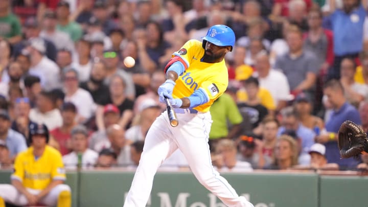 Boston Red Sox right fielder Jackie Bradley Jr. (19) hits a double against the Cleveland Guardians during the third inning at Fenway Park in 2022.