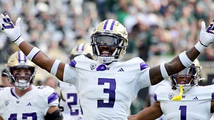Sep 16, 2023; East Lansing, Michigan, USA; Washington Huskies safety Mishael Powell (3) celebrates an interception of a Michigan State Spartans pass in the first quarter at Spartan Stadium. Mandatory Credit: Dale Young-USA TODAY Sports