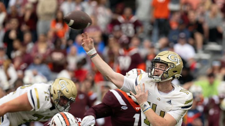 Nov 5, 2022; Blacksburg, Virginia, USA; Georgia Tech Yellow Jackets quarterback Zach Pyron (14) gets off a pass against Virginia Tech in the first half at Lane Stadium. Mandatory Credit: Lee Luther Jr.-Imagn Images