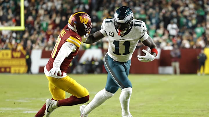 Dec 20, 2025; Landover, Maryland, USA; Philadelphia Eagles wide receiver A.J. Brown (11) runs against Washington Commanders cornerback Jonathan Jones (31) during the first half at Northwest Stadium. Mandatory Credit: Amber Searls-Imagn Images