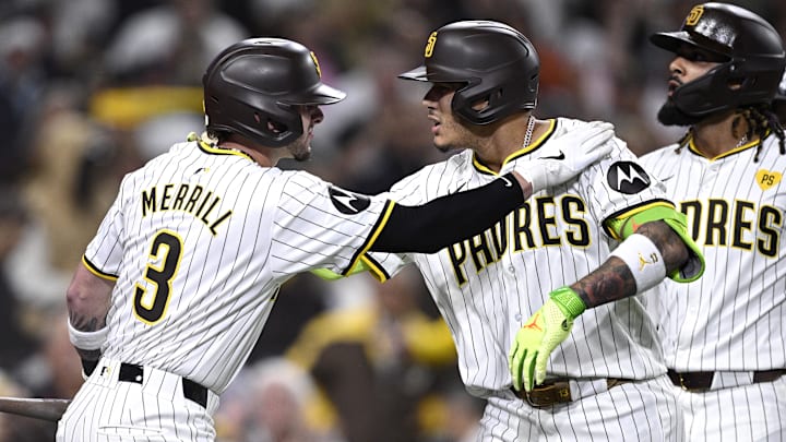 Sep 17, 2024; San Diego, California, USA; San Diego Padres third baseman Manny Machado (13) celebrates with center fielder Jackson Merrill (3) after hitting a two-run home run against the Houston Astros during the sixth inning at Petco Park.