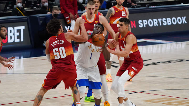 Denver Nuggets forward Aaron Gordon (50) and center Nikola Jokic (15) and forward Michael Porter Jr. (1) surround New Orleans Pelicans forward Zion Williamson (1) in the fourth quarter at Ball Arena. 