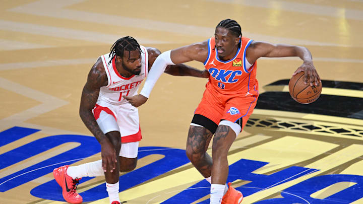 Dec 14, 2024; Las Vegas, Nevada, USA; Oklahoma City Thunder forward Jalen Williams (8) controls the ball against Houston Rockets forward Tari Eason (17) during the first half in a semifinal of the 2024 Emirates NBA Cup at T-Mobile Arena. Mandatory Credit: Candice Ward-Imagn Images