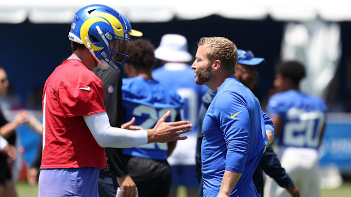 Jul 31, 2024; Los Angeles, CA, USA; Los Angeles Rams quarterback Matthew Stafford (9) and head coach Sean McVay talk during training camp at Loyola Marymount University. Mandatory Credit: Kiyoshi Mio-Imagn Images Jul 31, 2024; Los Angeles, CA, USA; Los Angeles Rams quarterback Matthew Stafford (9) and head coach Sean McVay talk during training camp at Loyola Marymount University. Mandatory Credit: Kiyoshi Mio-Imagn Images