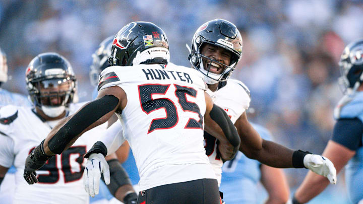 Nov 16, 2025; Nashville, Tennessee, USA;  Houston Texans defensive end Will Anderson Jr. (51) celebrates with defensive end Danielle Hunter (55) after his sack of Tennessee Titans quarterback Cameron Ward (1) during the second half at Nissan Stadium. Mandatory Credit: Steve Roberts-Imagn Images