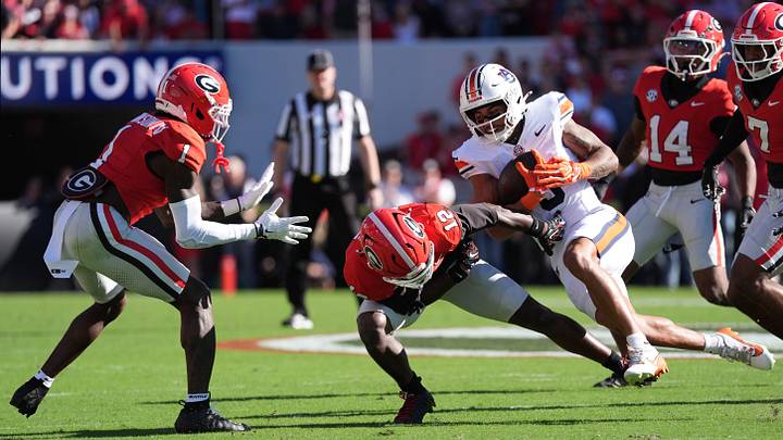 Oct 17, 2026; Athens, Georgia, USA; Auburn wide receiver Chas Nimrod (5) runs for a gain past Georgia safety Ja'marley Riddle (12) and defensive back Ellis Robinson IV (1) during the first quarter at Sanford Stadium. Mandatory Credit: Dale Zanine-Imagn Images Oct 17, 2026; Athens, Georgia, USA; Auburn wide receiver Chas Nimrod (5) runs for a gain past Georgia safety Ja'marley Riddle (12) and defensive back Ellis Robinson IV (1) during the first quarter at Sanford Stadium. Mandatory Credit: Dale Zanine-Imagn Images