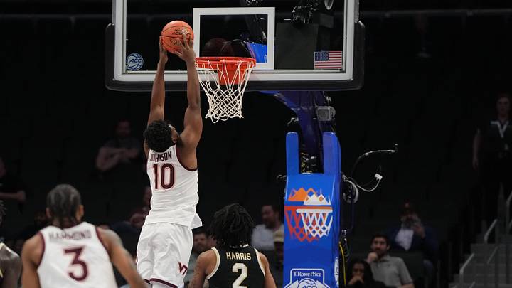 Mar 10, 2026; Charlotte, NC, USA; Virginia Tech guard Tyler Johnson (10) scores as Wake Forest forward Juke Harris (2) defends. Mar 10, 2026; Charlotte, NC, USA; Virginia Tech guard Tyler Johnson (10) scores as Wake Forest forward Juke Harris (2) defends.