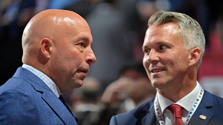 Jul 7, 2022; Montreal, Quebec, CANADA; Montreal Canadiens general manager Kent Hughes (left) talks with head coach Martin St. Louis before the first round of the 2022 NHL Draft at Bell Centre. Mandatory Credit: Eric Bolte-Imagn Images