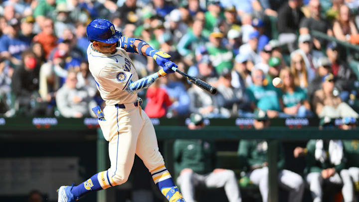 Seattle Mariners center fielder Julio Rodriguez (44) hits an RBI single against the Oakland Athletics during the fifth inning at T-Mobile Park in 2024.