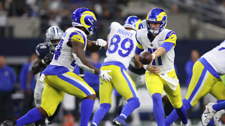 Oct 29, 2023; Arlington, Texas, USA; Los Angeles Rams quarterback Brett Rypien (11) hands off the