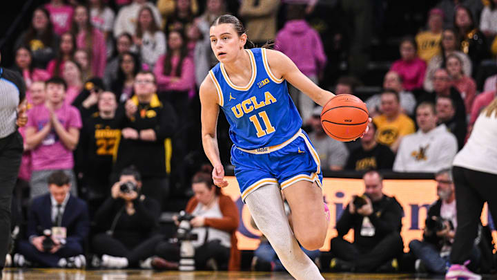 Feb 23, 2025; Iowa City, Iowa, USA; UCLA Bruins guard Gabriela Jaquez (11) dribbles against the Iowa Hawkeyes during the first quarter at Carver-Hawkeye Arena. Mandatory Credit: Jeffrey Becker-Imagn Images
