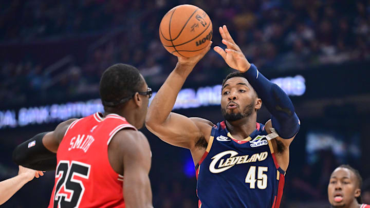 Nov 8, 2025; Cleveland, Ohio, USA; Cleveland Cavaliers guard Donovan Mitchell (45) passes as Chicago Bulls forward Jalen Smith (25) defends during the first half at Rocket Arena. Mandatory Credit: Ken Blaze-Imagn Images