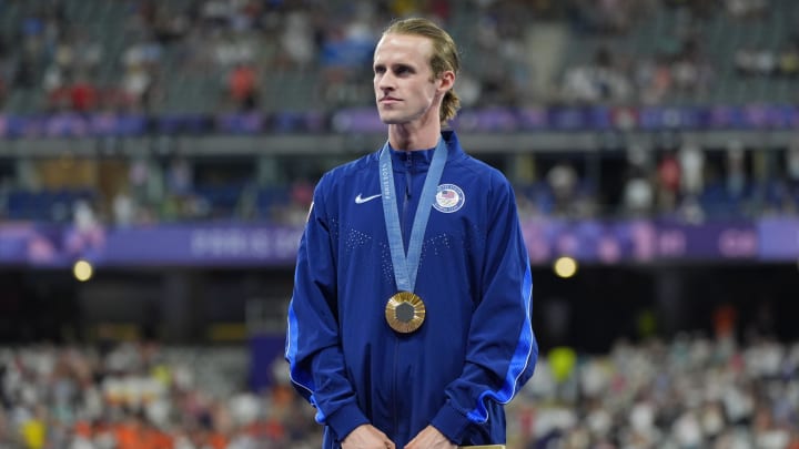 Aug 6, 2024; Paris Saint-Denis, France; Cole Hocker (USA) celebrates his gold medal in the men's 1500m during the Paris 2024 Olympic Summer Games at Stade de France. Mandatory Credit: Andrew Nelles-USA TODAY Sports Aug 6, 2024; Paris Saint-Denis, France; Cole Hocker (USA) celebrates his gold medal in the men's 1500m during the Paris 2024 Olympic Summer Games at Stade de France. Mandatory Credit: Andrew Nelles-USA TODAY Sports