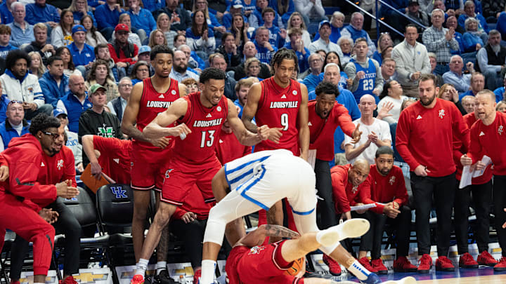 Kentucky Wildcats forward Brandon Garrison (10) fights for the jump ball against Louisville Cardinals forward James Scott (0) during their game on Saturday, Dec. 14, 2024 at Rupp Arena in Lexington, Ky.