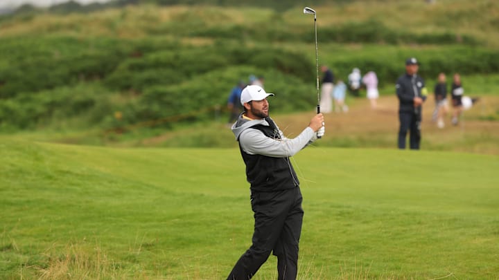 Scottie Scheffler plays from the rough on the 12th hole during the second round of The 153rd Open Championship golf tournament.