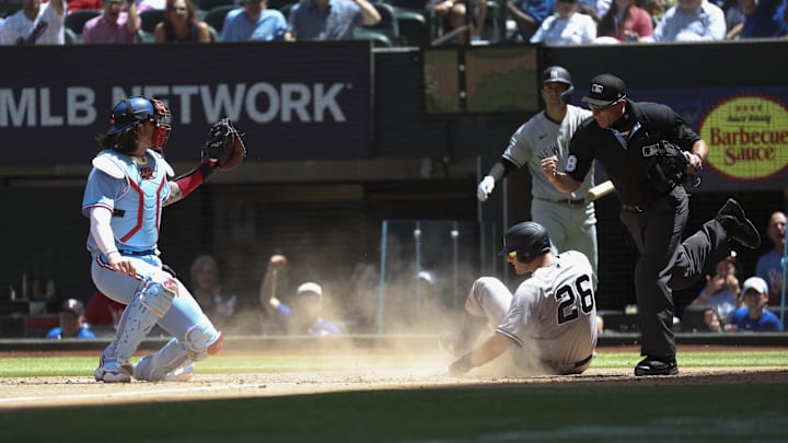 Apr 30, 2023; Arlington, Texas, USA;  Texas Rangers catcher Jonah Heim (28) tags out New York