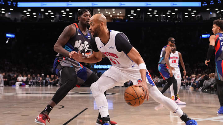 Apr 6, 2024; Brooklyn, New York, USA; Detroit Pistons forward Taj Gibson (67) dribbles the ball against Brooklyn Nets power forward Dorian Finney-Smith (28) during the first half at Barclays Center. Mandatory Credit: Gregory Fisher-USA TODAY Sports
