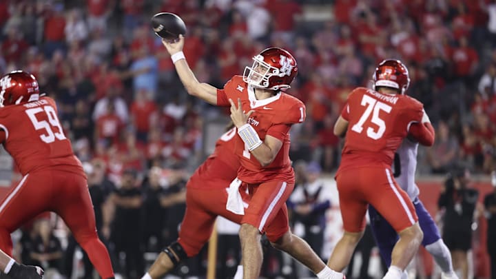 Nov 22, 2025; Houston, Texas, USA; Houston Cougars quarterback Conner Weigman (1) passes the ball during the fourth quarter against the TCU Horned Frogs at TDECU Stadium. Mandatory Credit: Troy Taormina-Imagn Images