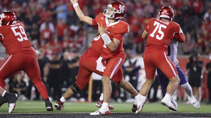 Nov 22, 2025; Houston, Texas, USA; Houston Cougars quarterback Conner Weigman (1) passes the ball during the fourth quarter against the TCU Horned Frogs at TDECU Stadium. Mandatory Credit: Troy Taormina-Imagn Images
